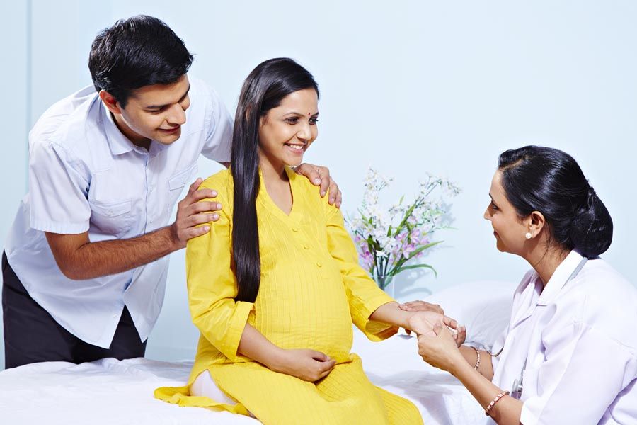 Female doctor examining a pregnant woman